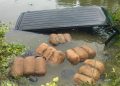 পুলিশের ধাওয়া খেয়ে পুকুরে মাইক্রোবাস, ভেসে উঠলো ৯ বস্তা গাঁজা